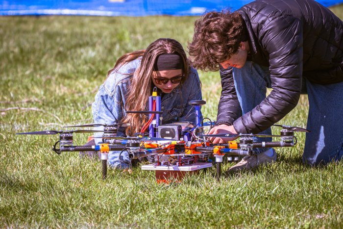 Case Western Reserve University Team examining their hexacopter after the flight mission. Case Western Reserve University Team